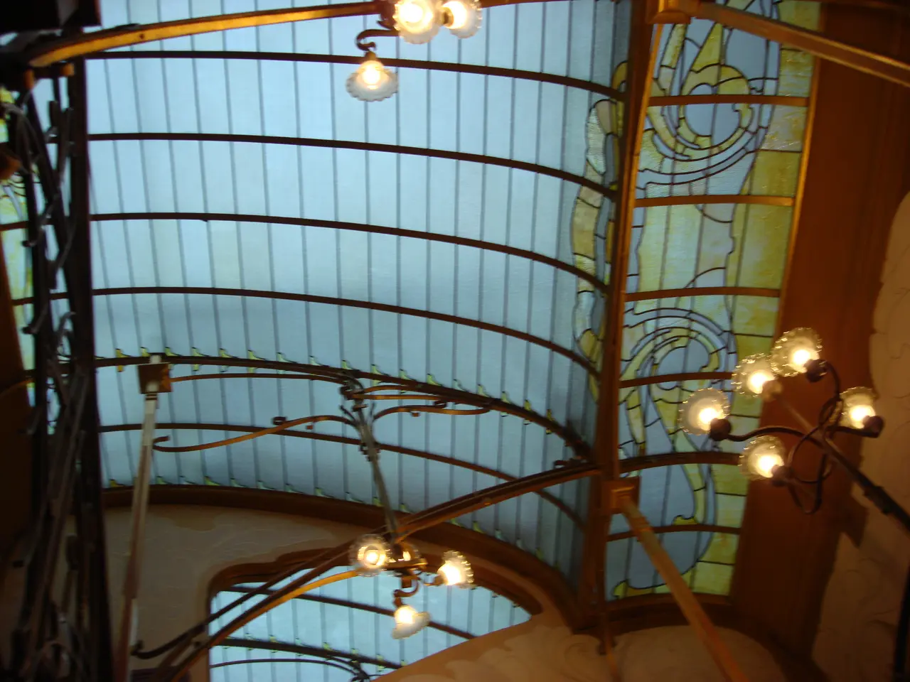 The glass lantern skylight over the stairwell of Horta's house, held on curved iron ribs